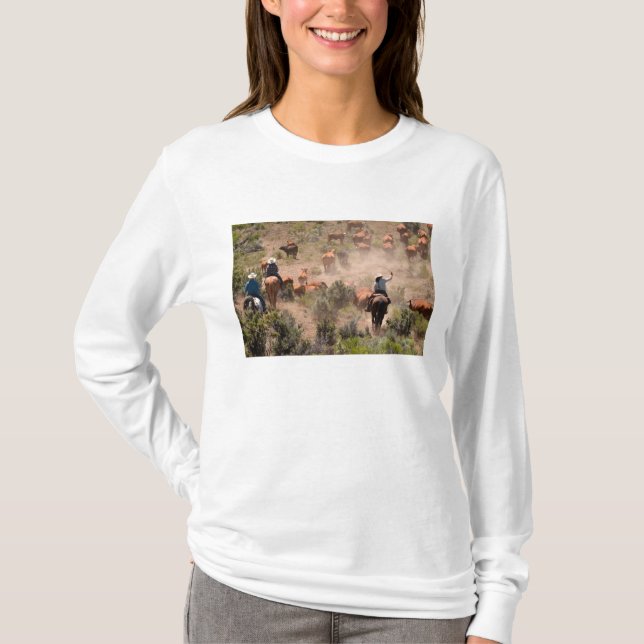 Three cowboys and cowgirls driving cattle T-Shirt (Front)