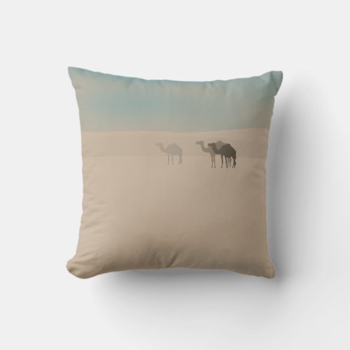 Three dromedary camels walking in Sahara desert Throw Pillow