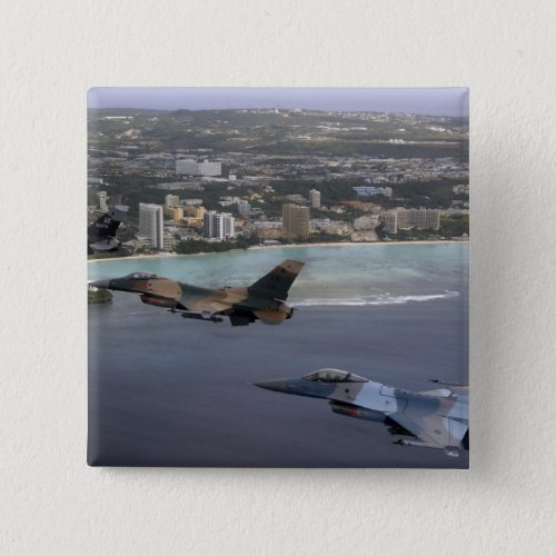 Three F_16 Fighting Falcons fly in formation Button