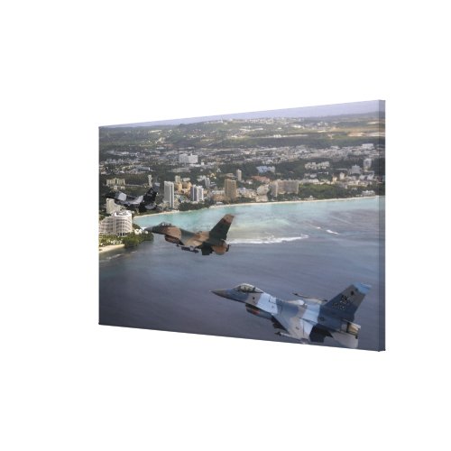 Three F_16 Fighting Falcons fly in formation Canvas Print