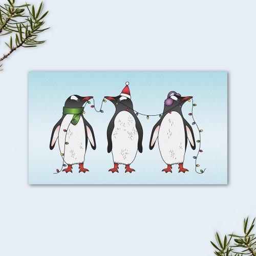Three Festive Christmas Penguins On Light Blue Business Card