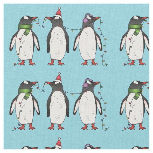 Three Festive Christmas Penguins On Light Blue Fabric