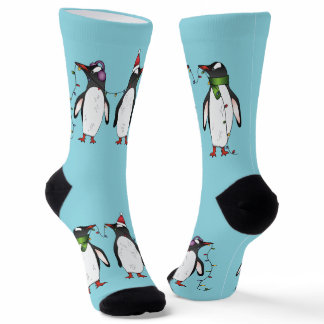 Three Festive Christmas Penguins On Light Blue Socks