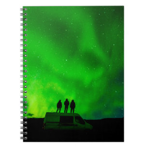 Three friends on an epic journey in their camper v notebook