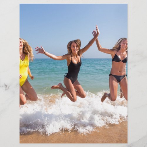 Three girls jumping on beach near seaJPG