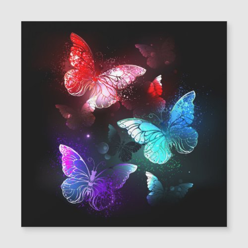 Three Glowing Butterflies on night background