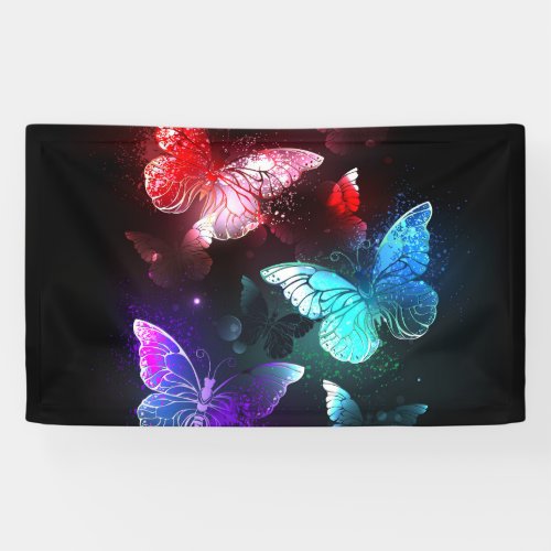 Three Glowing Butterflies on night background Banner