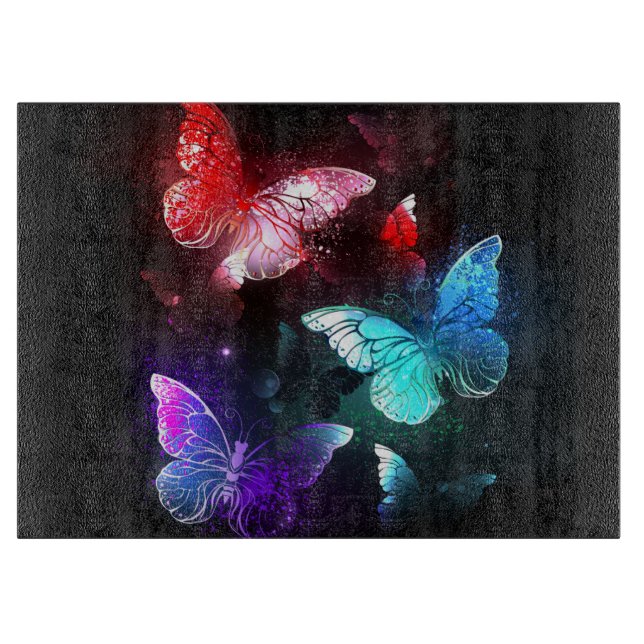Three Glowing Butterflies on night background Cutting Board (Front)