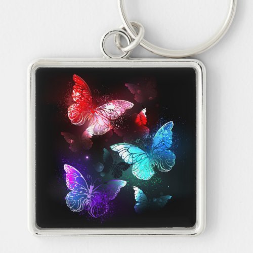 Three Glowing Butterflies on night background Keychain