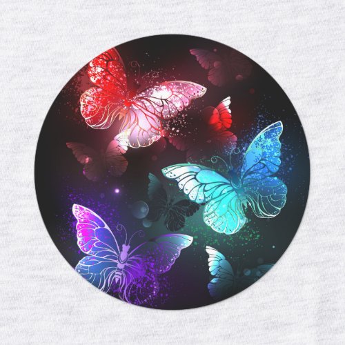 Three Glowing Butterflies on night background Labels