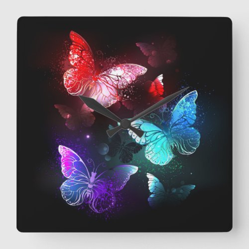 Three Glowing Butterflies on night background Square Wall Clock