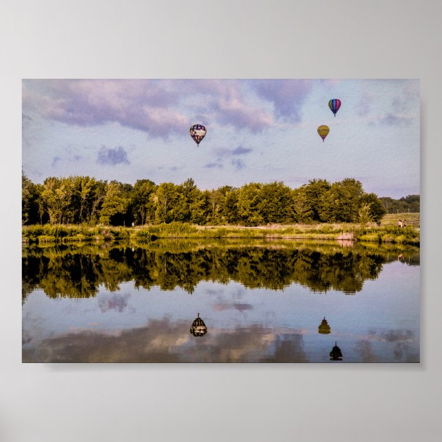 Three hot air balloons drifting over a landscape poster (Front)