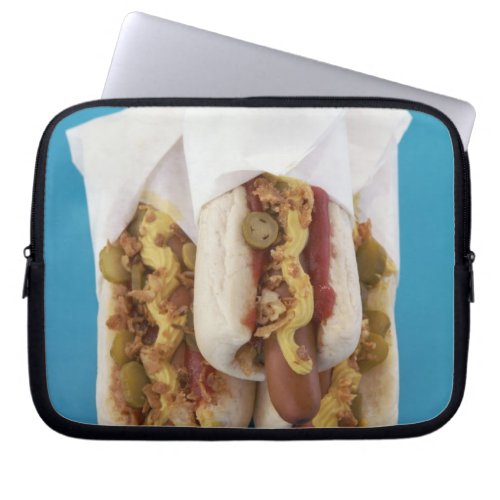 Three hot dogs in buns laptop sleeve