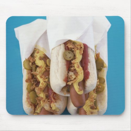 Three hot dogs in buns mouse pad