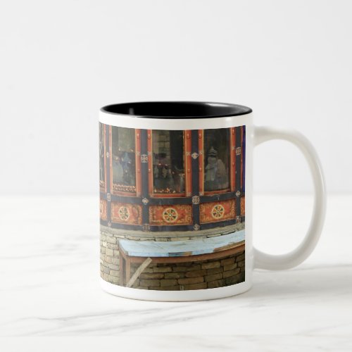 Three men sit on a bench at the Memorial Chorten Two_Tone Coffee Mug