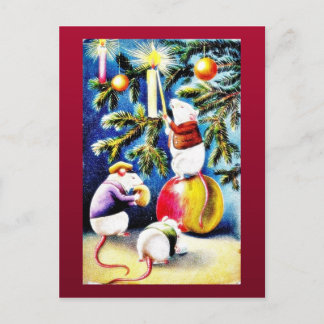 Three mice playing with gifts in the christmas tre holiday postcard