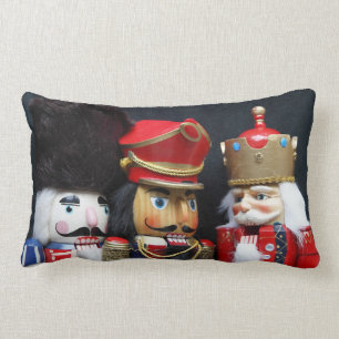Three nutcrackers on black lumbar pillow