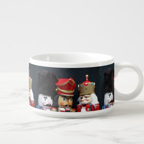 Three nutcrackers on dark background bowl