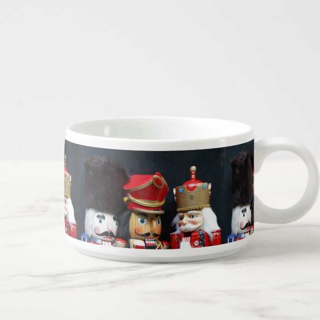 Three nutcrackers on dark background bowl (Left)