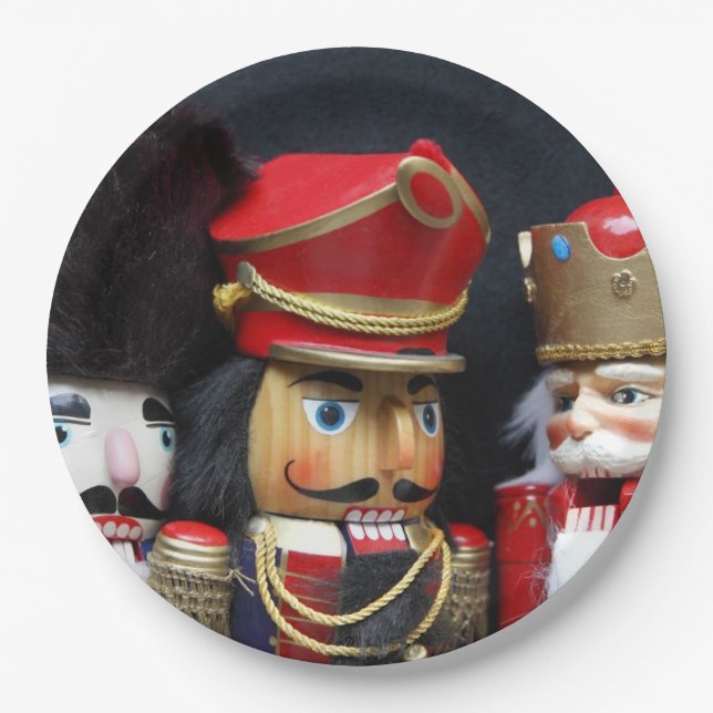 Three nutcrackers on dark background paper plates (Front)