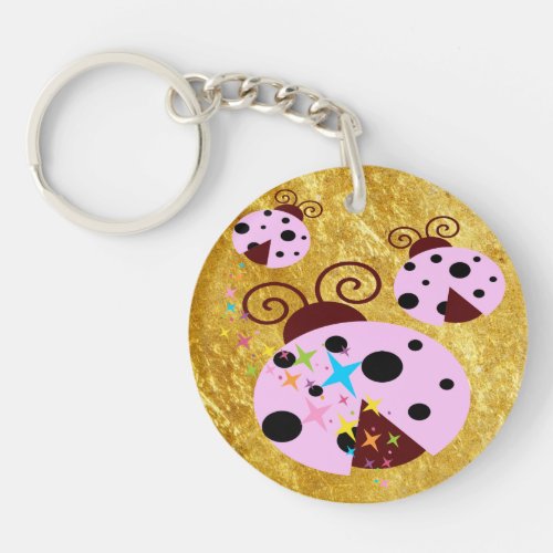 Three pink and black ladybug with stars keychain