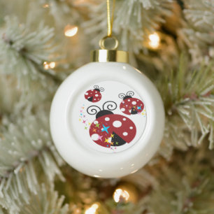 Three red and black ladybug with stars ceramic ball christmas ornament
