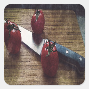 Three red tomatoes on a chopping board square sticker