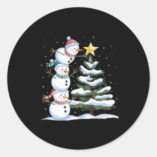 Three Snowmen Are Arranging A Christmas Tree Cute Classic Round Sticker