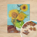 Three Sunflowers | Vincent van Gogh Jigsaw Puzzle<br><div class="desc">Three Sunflowers (1888) by Vincent van Gogh is a vibrant still life that showcases the artist’s signature thick brushstrokes and bold use of color. The painting features three sunflowers in a simple vase, their golden petals contrasting against the aqua blue background. Van Gogh's vivid yellow palette brings energy and life...</div>