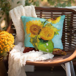 Three Sunflowers | Vincent van Gogh Outdoor Pillow<br><div class="desc">Three Sunflowers (1888) by Vincent van Gogh is a vibrant still life that showcases the artist’s signature thick brushstrokes and bold use of color. The painting features three sunflowers in a simple vase, their golden petals contrasting against the aqua blue background. Van Gogh's vivid yellow palette brings energy and life...</div>