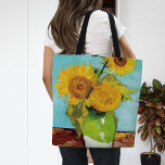 Three Sunflowers | Vincent Van Gogh Tote Bag<br><div class="desc">Three Sunflowers (1888) by Dutch artist Vincent Van Gogh. Original fine art painting is an oil on canvas depicting a still life of bright yellow sunflowers against a turquoise background. 

Use the design tools to add custom text or personalize the image.</div>