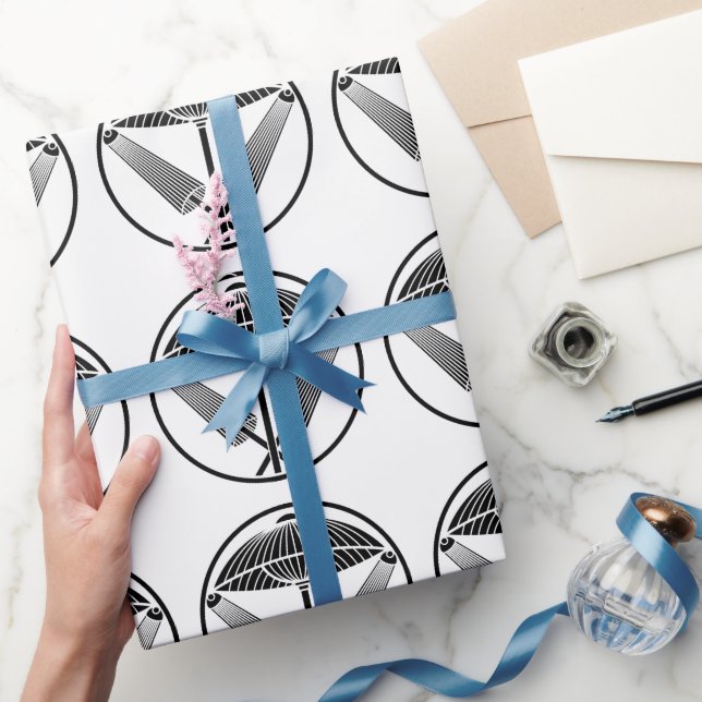 Three umbrellas in a threadlike ring wrapping paper (Gifting)
