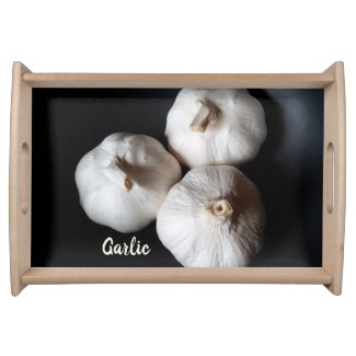 Three White Garlic Cloves on Black