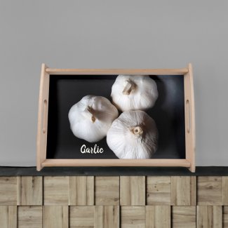Three White Garlic Cloves on Black