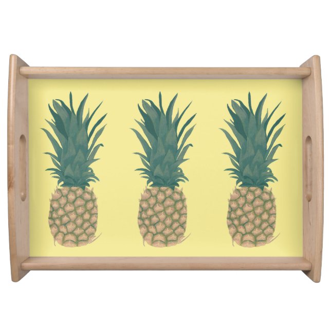 Three Whole Pineapples on Yellow Serving Trays (Front)
