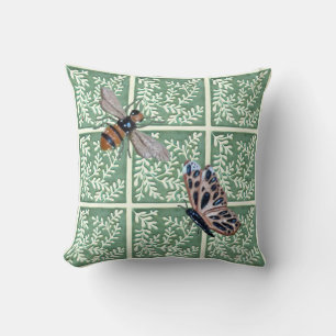 Throw pillow with green foliage and pollinators
