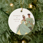 Tiana and Naveen Wedding Keepsake  Ceramic Ornament<br><div class="desc">Celebrate your happily ever after with this charming wedding ornament featuring Princess Tiana and Prince Naveen. Personalized with your names and wedding date, this ornament captures the magic of your special day in true Disney style. Perfect for your first holiday season as newlyweds or as a heartfelt gift, it’s a...</div>