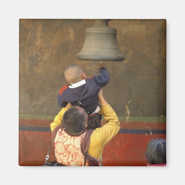 Tibetan Buddhist monk lifting a boy to ring a Magnet (Front)