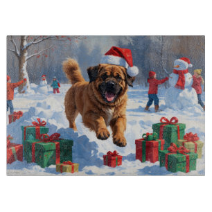 Tibetan Mastiff Running in Snow with Christmas Hat Cutting Board