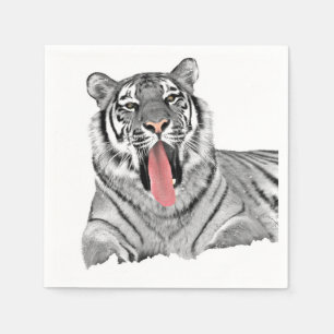 Tiger lying in snow and showing tongue napkins