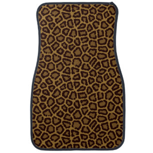 Tile background with a leopard fur car floor mat