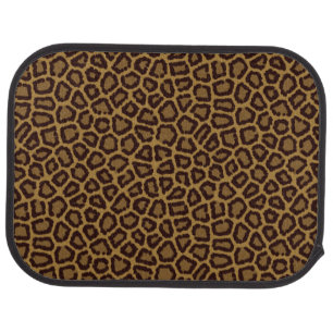 Tile background with a leopard fur car mat