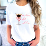 'Tini Bit Older Espresso Martini Coquette Birthday T-Shirt<br><div class="desc">This sophisticated and enjoyable invitation showcases a lovely floral design in pink and white, ideal for a refined birthday gathering. The addition of an espresso martini brings a touch of elegance and establishes a chic atmosphere for the event. The phrase "Tini bit older" suggests a playful and flirtatious theme, indicating...</div>