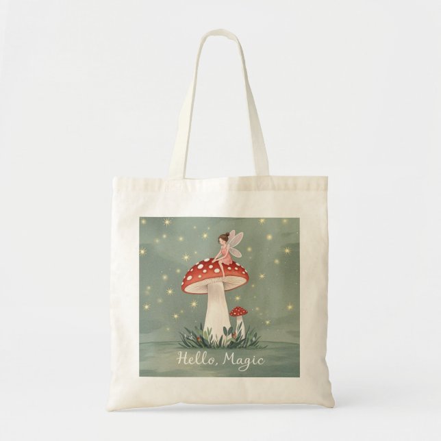Tiny fairy perched on top of mushroom and glowing  tote bag (Front)