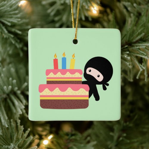 Tiny Ninja Behind Birthday Cake on Green Ceramic Ornament