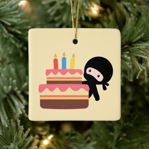 Tiny Ninja Behind Birthday Cake on Yellow Ceramic Ornament