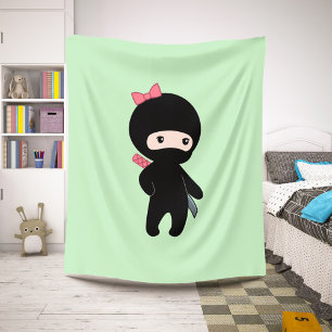 Tiny Ninja Girl on Green Sherpa Blanket
