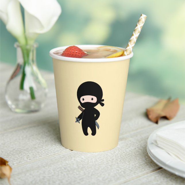 Tiny Ninja Holding Throwing Star on Yellow Paper Cups (Insitu)
