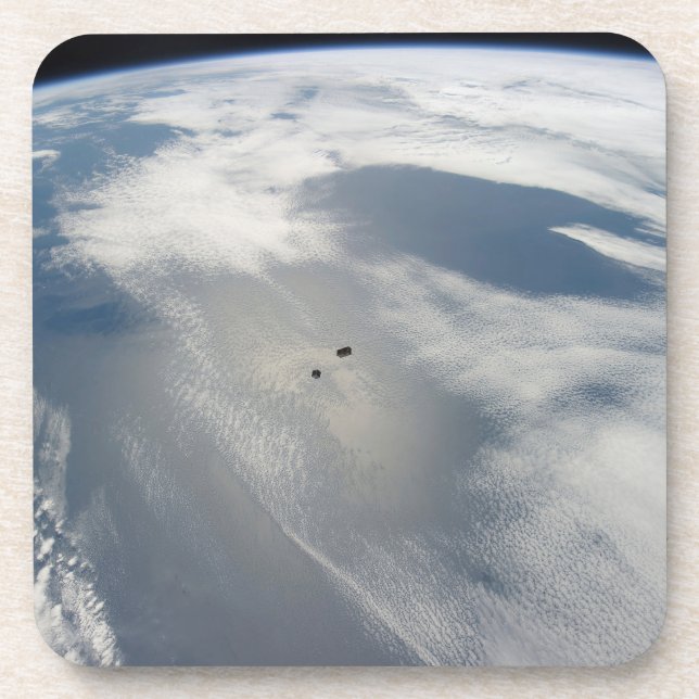 Tiny Satellites Orbit Above A Part Of Earth. Beverage Coaster (Front)