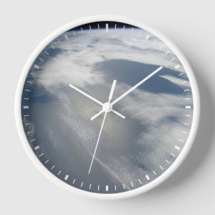 Tiny Satellites Orbit Above A Part Of Earth. Clock